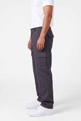 Person wearing gray cargo pants on a white background